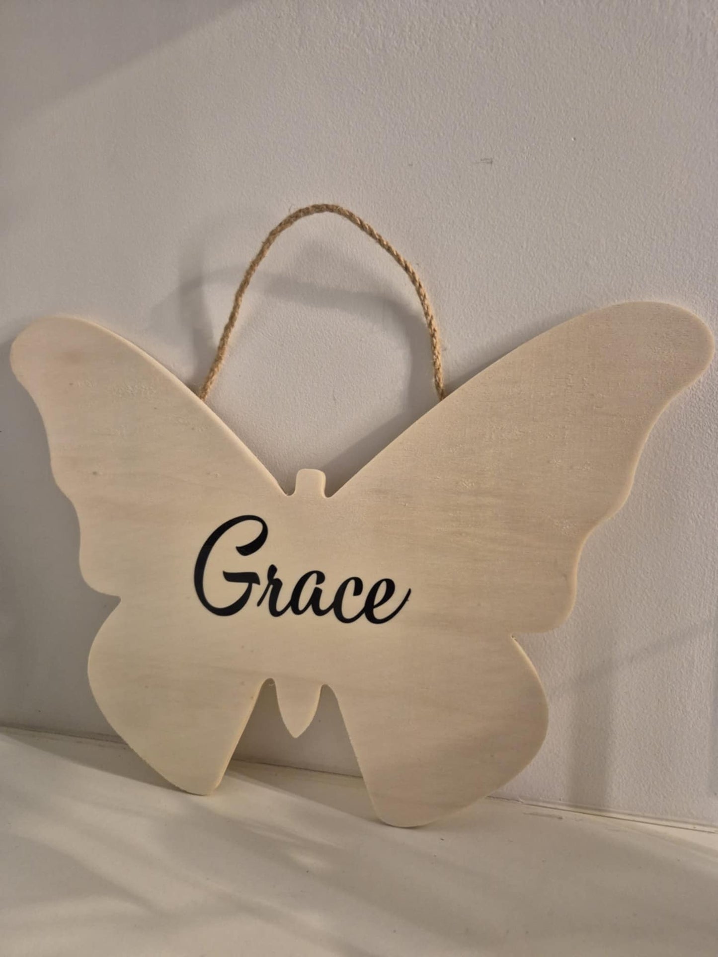 Personalised butterfly-shaped sign with custom tex